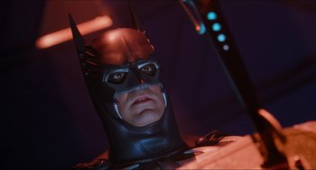 Movie still from “Batman & Robin” (1997), directed by Joel Schumacher – A man's face in a batman mask; Close Up shot, Low angle
