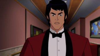 Movie still from “Batman: Soul of the Dragon” (2021), directed by Sam Liu – A man wearing a red jacket and a black bow tie; Medium shot, Over the shoulder angle