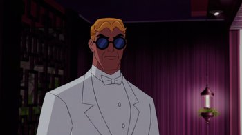 Movie still from “Batman: Soul of the Dragon” (2021), directed by Sam Liu – A man in a white suit and blue sunglasses; Medium shot, Low angle