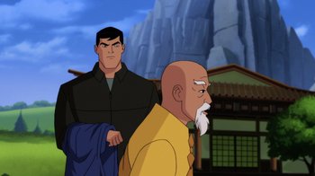 Movie still from “Batman: Soul of the Dragon” (2021), directed by Sam Liu – A cartoon of a man standing next to a bald man; Medium shot, Over the shoulder angle