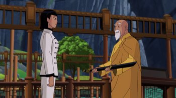 Movie still from “Batman: Soul of the Dragon” (2021), directed by Sam Liu – A man in a yellow robe is holding a sword; Medium shot, Over the shoulder angle