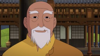 Movie still from “Batman: Soul of the Dragon” (2021), directed by Sam Liu – An old man with a white beard is smiling; Close Up shot, Low angle
