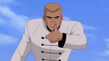 Movie still from “Batman: Soul of the Dragon” (2021), directed by Sam Liu – A bald man in a white jacket is pointing his finger to his face; Medium shot, Low angle