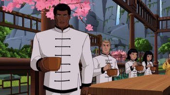 Movie still from “Batman: Soul of the Dragon” (2021), directed by Sam Liu – A group of men standing next to each other holding cups; Medium shot, Over the shoulder angle