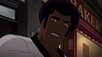 Movie still from “Batman: Soul of the Dragon” (2021), directed by Sam Liu – An animated man with black hair and brown eyes looking angry; Close Up shot, Over the shoulder angle