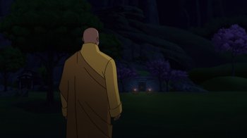 Movie still from “Batman: Soul of the Dragon” (2021), directed by Sam Liu – A man standing in the dark in front of trees; Extreme Wide shot, Over the shoulder angle