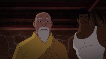 Movie still from “Batman: Soul of the Dragon” (2021), directed by Sam Liu – An old man with a bald head and a beard; Medium shot, Over the shoulder angle