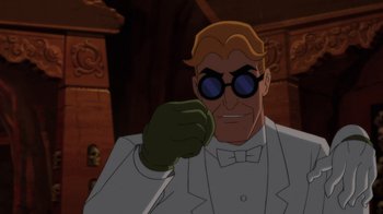 Movie still from “Batman: Soul of the Dragon” (2021), directed by Sam Liu – A man in a white suit and green gloves holding something; Medium shot, Over the shoulder angle