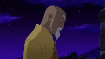 Movie still from “Batman: Soul of the Dragon” (2021), directed by Sam Liu – An old man with a beard is standing in front of a night sky; Medium shot, Low angle