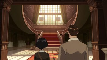 Movie still from “Batman: The Doom That Came to Gotham” (2023), directed by Sam Liu – A man and a woman are looking at a staircase; Extreme Wide shot, High angle