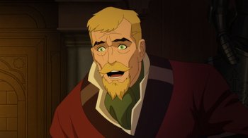 Movie still from “Batman: The Doom That Came to Gotham” (2023), directed by Sam Liu – An animated picture of a man with a goatee and beard; Close Up shot, Over the shoulder angle