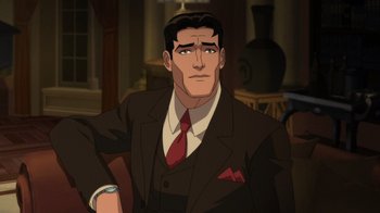 Movie still from “Batman: The Doom That Came to Gotham” (2023), directed by Sam Liu – A man wearing a suit and tie in a room; Medium shot, High angle