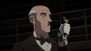Movie still from “Batman: The Doom That Came to Gotham” (2023), directed by Sam Liu – An animated man with a mustache holding up a phone; Close Up shot, Low angle