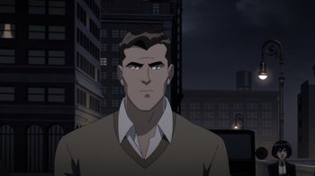 Movie still from “Batman: The Doom That Came to Gotham” (2023), directed by Sam Liu – A man in a brown shirt is standing in front of a building; Medium shot, Over the shoulder angle