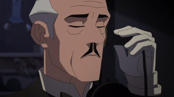 Movie still from “Batman: The Doom That Came to Gotham” (2023), directed by Sam Liu – An old man with a white beard is looking at a cell phone; Close Up shot, Over the shoulder angle