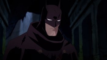 Movie still from “Batman: The Doom That Came to Gotham” (2023), directed by Sam Liu – Batman in a dark setting; Close Up shot, Low angle