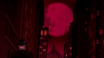 Movie still from “Batman: The Doom That Came to Gotham” (2023), directed by Sam Liu – A large red moon in the sky over a city; Extreme Wide shot, Low angle