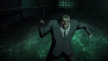 Movie still from “Batman: The Long Halloween” (2021), directed by Chris Palmer – An animated man in a suit holding a knife; Medium shot, High angle