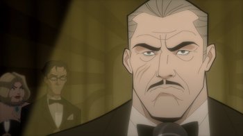 Movie still from “Batman: The Long Halloween” (2021), directed by Chris Palmer – An older man in a suit and tie looking at himself in the mirror; Close Up shot, Over the shoulder angle