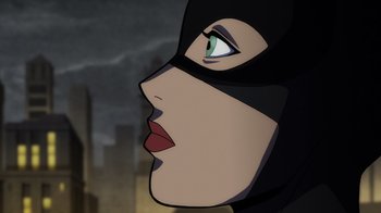 Movie still from “Batman: The Long Halloween” (2021), directed by Chris Palmer – A woman with a black mask on her face; Close Up shot, Low angle