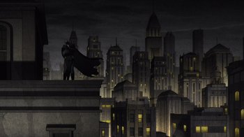 Movie still from “Batman: The Long Halloween” (2021), directed by Chris Palmer – A man standing on top of a building in the dark; Extreme Wide shot, Low angle