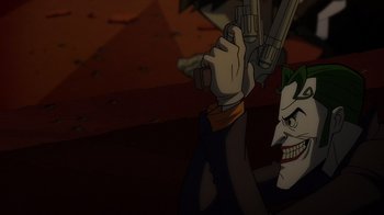 Movie still from “Batman: The Long Halloween” (2021), directed by Chris Palmer – The joker is holding a gun up to his head; Close Up shot, Over the shoulder angle