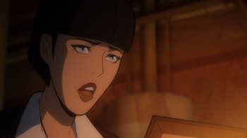 Movie still from “Batman: The Long Halloween” (2021), directed by Chris Palmer – An animated picture of a woman with short black hair; Close Up shot, Over the shoulder angle