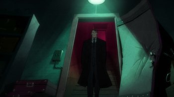 Movie still from “Batman: The Long Halloween, Part Two” (2021), directed by Chris Palmer – A man standing in a dark room next to a staircase; Wide shot, Low angle