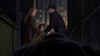 Movie still from “Batman: The Long Halloween, Part Two” (2021), directed by Chris Palmer – An animated scene of a man and woman and a child; Medium shot, Over the shoulder angle
