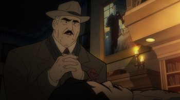 Movie still from “Batman: The Long Halloween, Part Two” (2021), directed by Chris Palmer – An animated picture of a man in a suit and a hat; Medium shot, Over the shoulder angle