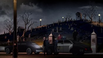 Movie still from “Batman: The Long Halloween, Part Two” (2021), directed by Chris Palmer – A group of men standing next to a car in front of a cemetery; Extreme Wide shot, High angle