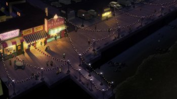 Movie still from “Batman: The Long Halloween, Part Two” (2021), directed by Chris Palmer – An aerial view of a boardwalk at night with lights; Extreme Wide shot, High angle