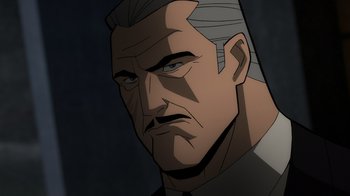 Movie still from “Batman: The Long Halloween, Part Two” (2021), directed by Chris Palmer – An animated picture of a man with a gray hair; Close Up shot, Low angle