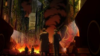 Movie still from “Batman: The Long Halloween, Part Two” (2021), directed by Chris Palmer – A group of people standing in front of a fire; Extreme Wide shot, High angle