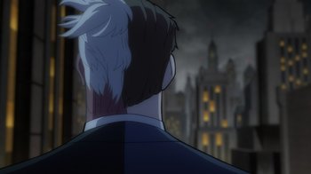 Movie still from “Batman: The Long Halloween, Part Two” (2021), directed by Chris Palmer – The back of a man's head as he looks out over a city; Close Up shot, Over the shoulder angle