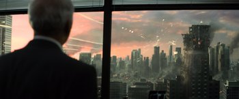 Movie still from “Batman v Superman: Dawn of Justice” (2016), directed by Zack Snyder – A view of a city from the window of an office building; Extreme Wide shot, Over the shoulder angle