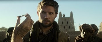 Movie still from “Batman v Superman: Dawn of Justice” (2016), directed by Zack Snyder – A person with a beard; Close Up shot, Over the shoulder angle