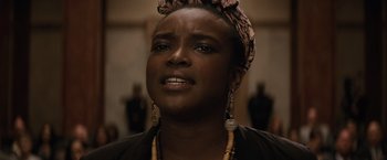 Movie still from “Batman v Superman: Dawn of Justice” (2016), directed by Zack Snyder – A person wearing a head scarf; Close Up shot, Low angle