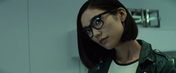 Movie still from “Batman v Superman: Dawn of Justice” (2016), directed by Zack Snyder – A person wearing glasses; Close Up shot, Low angle