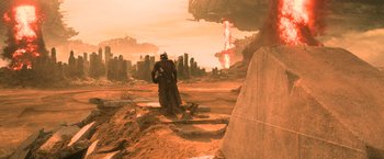 Movie still from “Batman v Superman: Dawn of Justice” (2016), directed by Zack Snyder – An image of a man standing in the middle of the desert; Extreme Wide shot, Over the shoulder angle