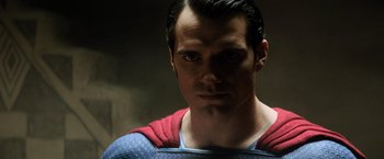 Movie still from “Batman v Superman: Dawn of Justice” (2016), directed by Zack Snyder – A person wearing a superman costume; Close Up shot, Over the shoulder angle