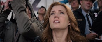 Movie still from “Batman v Superman: Dawn of Justice” (2016), directed by Zack Snyder – A person looking up at the sky; Close Up shot, Low angle