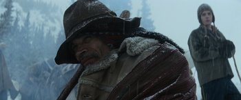 Movie still from “Batman v Superman: Dawn of Justice” (2016), directed by Zack Snyder – An old man wearing a hat in the snow; Close Up shot, Low angle