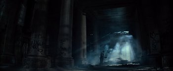 Movie still from “Batman v Superman: Dawn of Justice” (2016), directed by Zack Snyder – A man standing in a room with smoke coming out of the ceiling; Extreme Wide shot, Low angle