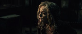 Movie still from “Batman v Superman: Dawn of Justice” (2016), directed by Zack Snyder – A person with long blonde hair; Close Up shot, Over the shoulder angle