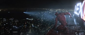 Movie still from “Batman v Superman: Dawn of Justice” (2016), directed by Zack Snyder – A gorilla standing on top of a skyscraper at night; Extreme Wide shot, High angle