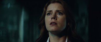 Movie still from “Batman v Superman: Dawn of Justice” (2016), directed by Zack Snyder – A person with long red hair; Close Up shot, Low angle