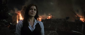 Movie still from “Batman v Superman: Dawn of Justice” (2016), directed by Zack Snyder – A woman standing in front of a burning forest; Close Up shot, Low angle
