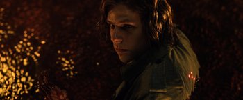 Movie still from “Batman v Superman: Dawn of Justice” (2016), directed by Zack Snyder – A person with long brown hair; Close Up shot, High angle