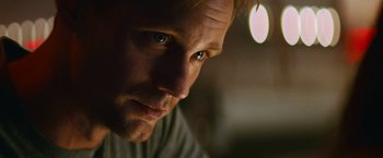 Movie still from “Battleship” (2012), directed by Peter Berg – A man's face in the dark; Close Up shot, Over the shoulder angle